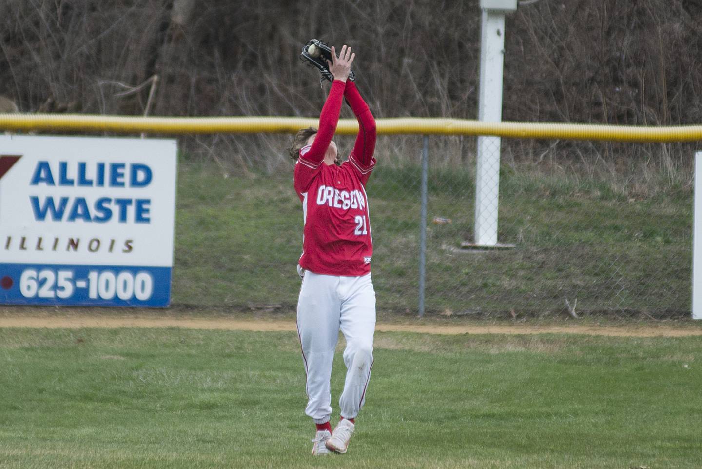 Oregon’s Avery Lewis hauls in a fly ball for an out against Dixon Tuesday, April 5, 2022.