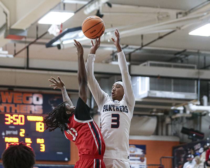 Oswego's Ethan Vahl (3) shoots a jumper during their basketball game between West Aurora at Oswego Monday, Nov 24, 2025 in Oswego.