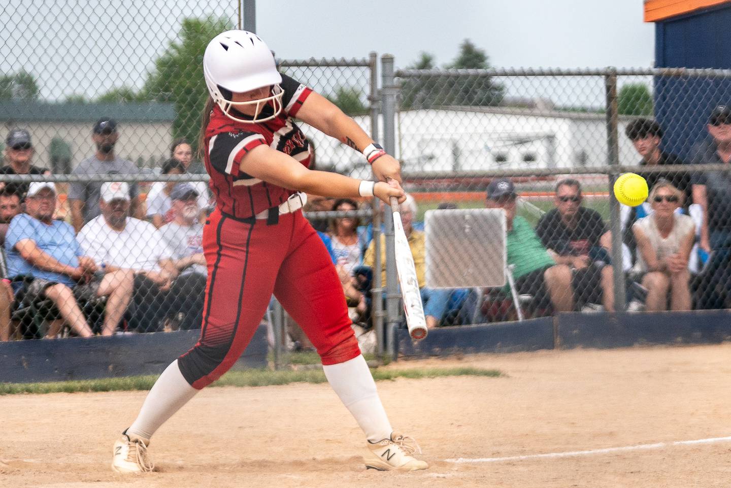 Yorkville's Sara Ebner (14) triples driving in a run against Oswego East during the Class 4A Oswego softball sectional semifinal game between Yorkville and Oswego East at Oswego High School on Tuesday, May 30, 2023.
