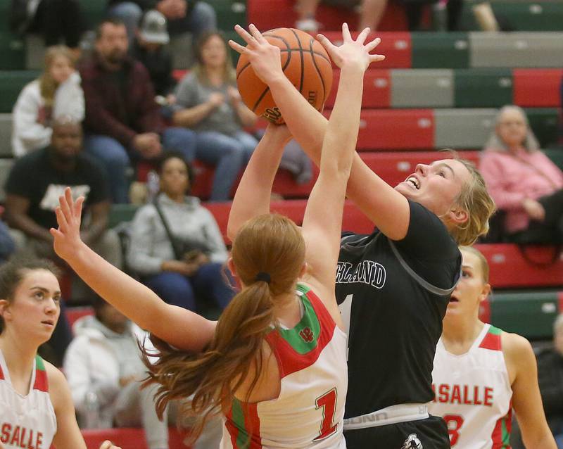 Kaneland's Berlyn Ruh eyes the hoop as L-P's Addison Duttlinger defends on Friday, Dec. 8, 2023 in Sellett Gymnasium at L-P High School.