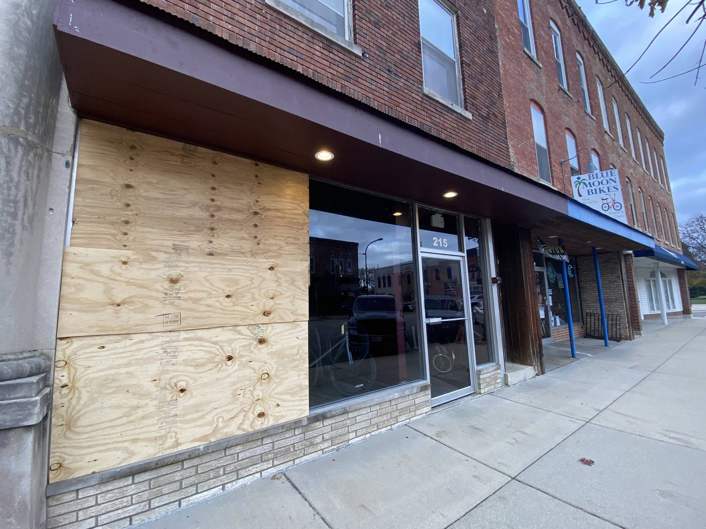 A deer crashed into a window at Blue Moon Bikes shop, 211 W. State St., on Saturday, Nov. 9, 2024. The damaged window, shown Sunday, Nov. 10, 2024, was boarded up by the next day.