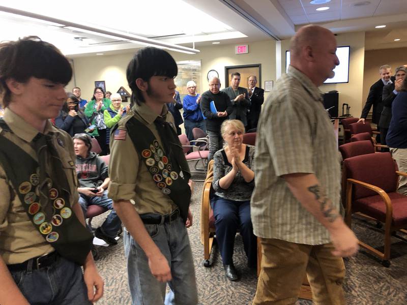 Shane, left, Joey and Jay Wolf attended the McHenry County Board meeting on Tuesday, Nov. 15, 2022, where they were recognized for helping to save a woman from her burning car on Oct. 30, 2022.