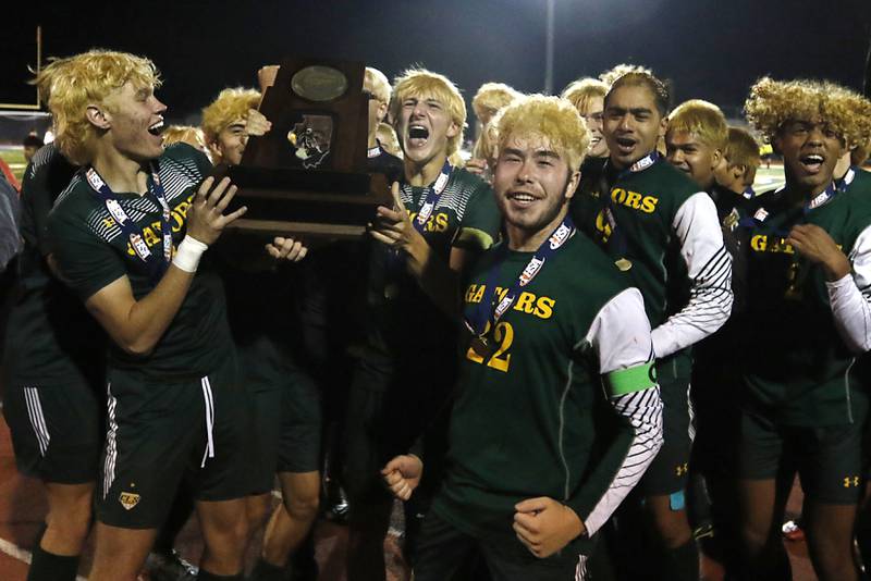 Crystal Lake South players celebrate winning the IHSA Class 2A state championship soccer match against Peoria Notre Dame on Saturday, Nov. 4, 2023, at Hoffman Estates High School.