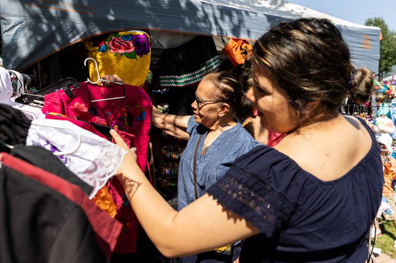 West Chicago residents Carolina and Kathy Rudio shop during Barro Fest at Settlers' Park in Plainfield on July 27, 2024.