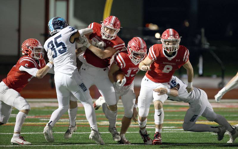 Naperville Central's Aiden Clark moves upfield against Downers Grove South Friday October 27, 2023 in Naperville.