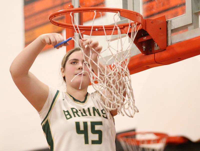 St. Bede's Savannah Bray cuts down a piece of the net after defeating Serena in the Class 1A Sectional final game on Thursday, Feb. 22, 2024 at Gardner-South Wilmington High School.