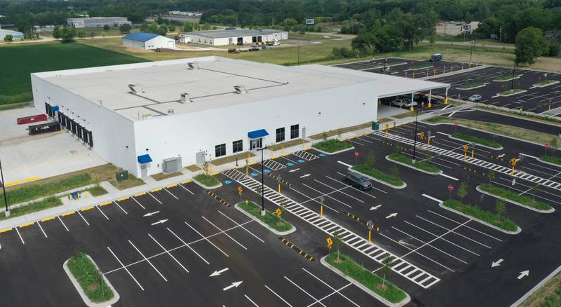 Crews have nearly completed the exterior portion of the Amazon last-mile delivery facility on Wednesday, July 9, 2025, at the Ottawa Industrial Park. Amazon signage is being assembled along with new landscaping. The 50,800-square-foot warehouse will be an addition to Amazon's regional logistics network, helping streamline package delivery to residents and businesses across the region.