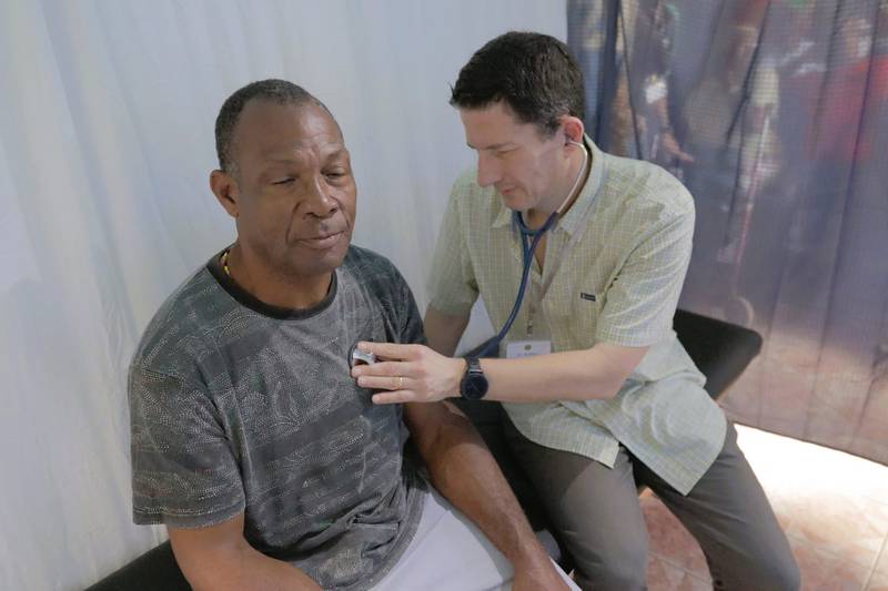 Dr. Nathan Kakish from Northwestern Medicine helps a patient during his visit with The Joshua Mission to prove healthcare to over 500 people in Negril, Jamaica.