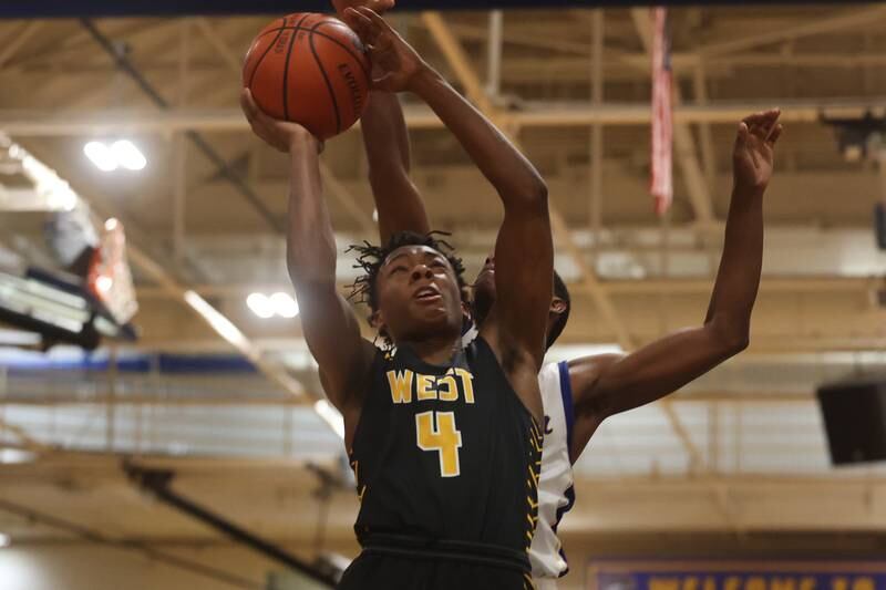 Joliet West’s Aaron Gant Jr goes in for a basket against Joliet Central.
