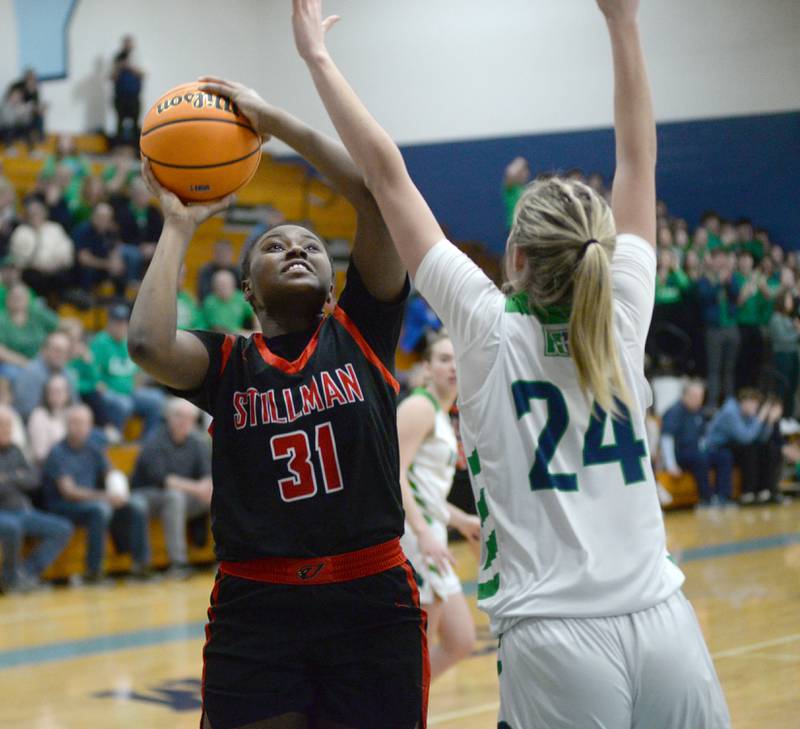 Stillman Valley's Dailene Wade (31) shoots as Peoria Notre Dame's Lexi Baer (24) defends during the 2A Super-Sectional on Monday, March 3, 2025 at Bureau Valley High School in Manlius.