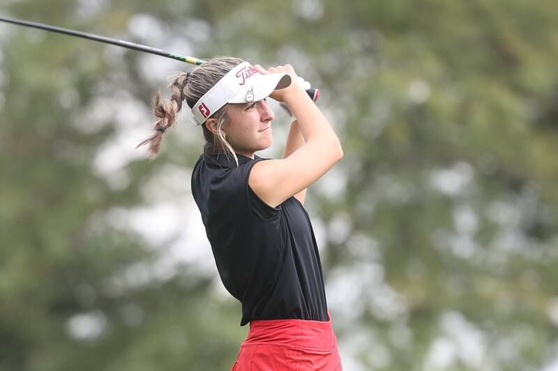 Lincoln-Way Central’s Sarah Arsich drives off hole 11 in the Class 2A Bradley Regionals at the Green Garden Country Club in Frankfort on Thursday, Sept. 28, 2023.