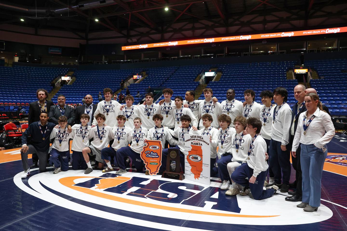 IC Catholic poses with the IHSA Class 2A Dual Team State championship trophy following their victory over Providence Catholic on Saturday, Feb. 28, 2026.