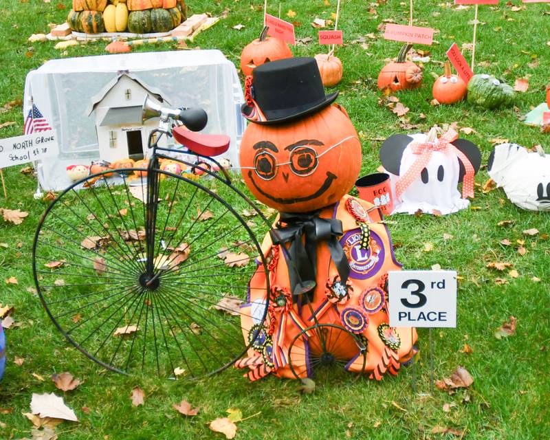 The The Becker Family received 3rd place in the family category with presidential faces placed on pumpkins during the Sycamore Pumpkin Festival that was on display at the Sycamore Courthouse lawn on Friday Oct. 27, 2023.