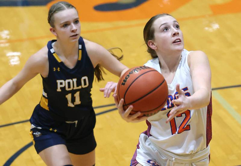 Genoa-Kingston's Ally Poegel gets a layup in front of Polo's Courtney Grobe during their game Monday, Jan. 29, 2024, at Genoa-Kingston High School.
