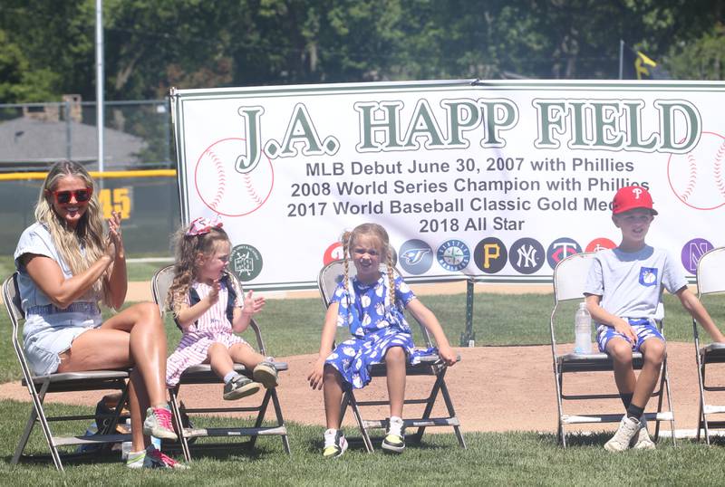 (From left) J.A. Happ's wife Morgan, Bella, Sloan and James "JJ" applaud during the J.A. Happ Day and field dedication on Sunday, July 30, 2023 at Washington Park in Peru.