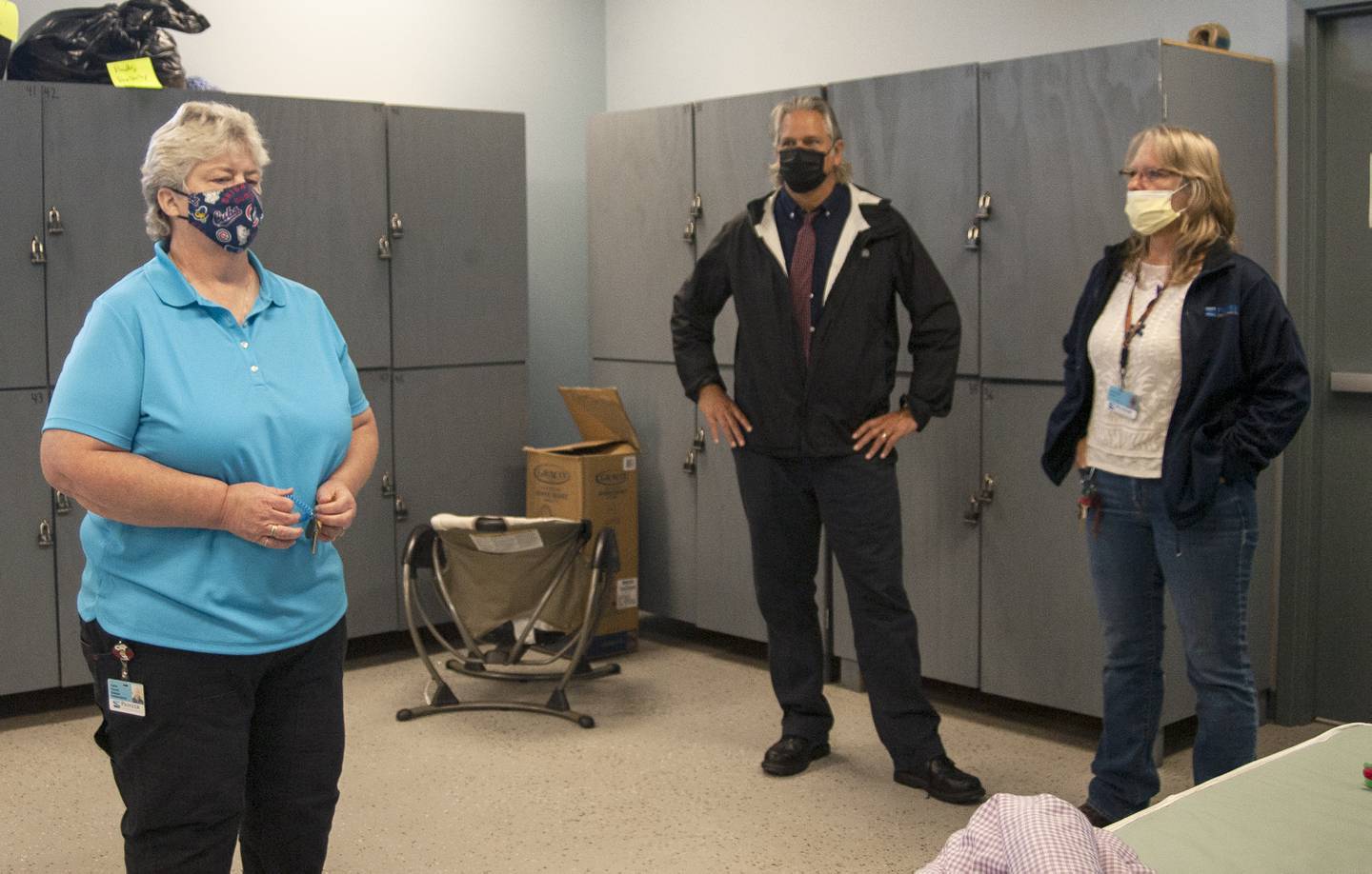 Pictured from left to right, Pioneer Center Director of Homeless Services Carrie Freund, Co-CEO Sam Tenudo and  Guest Services Coordinator Kim Roush give the Northwest Herald a tour on Monday, Oct. 18, 2021, of the new McHenry PADS shelter.