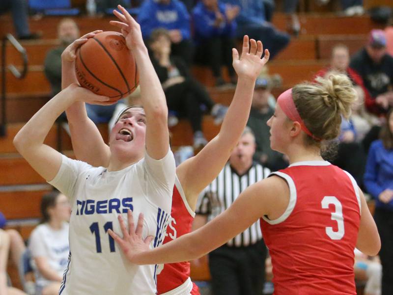 Princeton's Makayla Hecht eyes the hoop as she is guarded by Ottawa's Kendall Lowery and Skylar Dorsey on Monday, Feb. 5, 2024 in Prouty Gym.