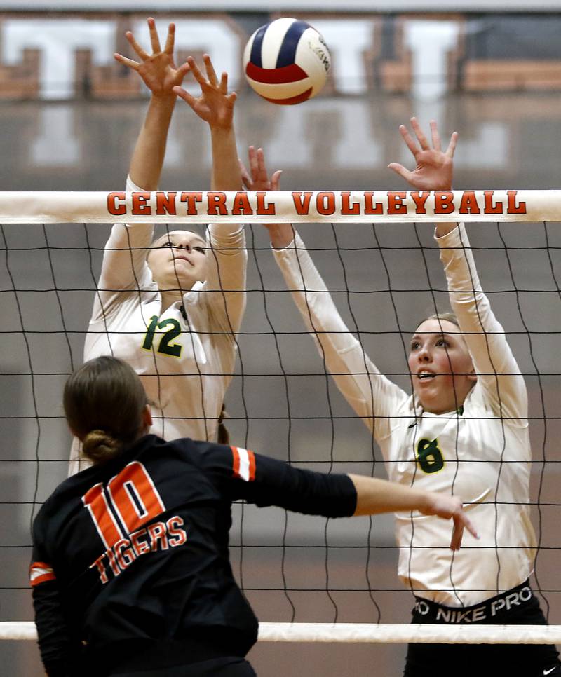 Crystal Lake South's Joanna Kruzolek and  Anna Hougas trie to block the hit of Crystal Lake Central's Marin McCain during the IHSA Class 3A Crystal Lake Central Regional volleyball final on Oct. 31, 2024, at Crystal Lake Central High School.