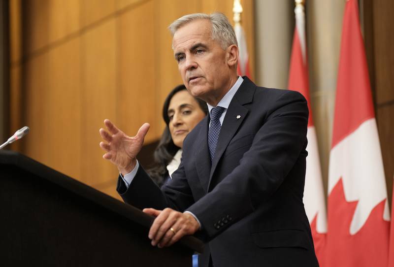 Canada Prime Minister Mark Carney speaks with media during a news conference in Ottawa, Ontario, Wednesday, July 30, 2025. (Adrian Wyld/The Canadian Press via AP)