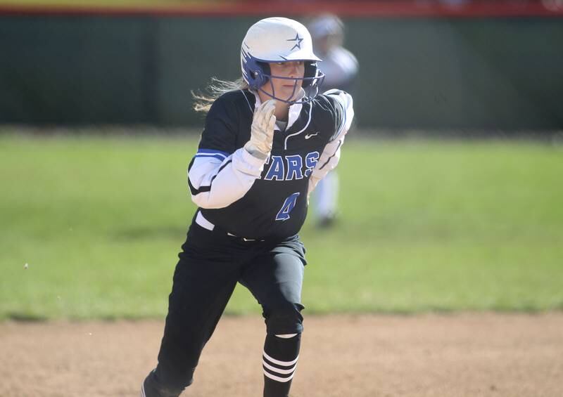 St. Charles North’s Julia Larson runs home during a game at Wheaton Warrenville South on Thursday, April 14, 2022.