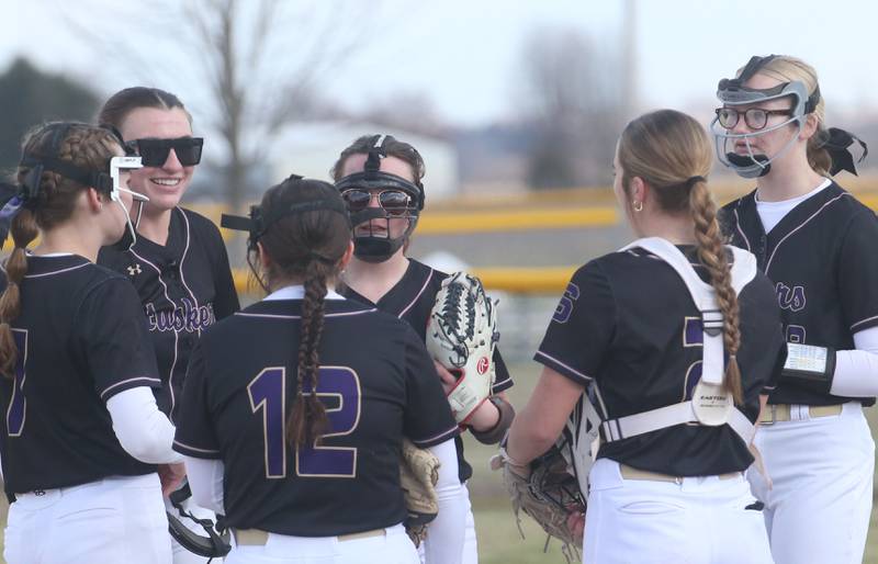 Members of the Serena softball team meet on the mound between innings on Wednesday, March 26, 2025 at Serena High School.