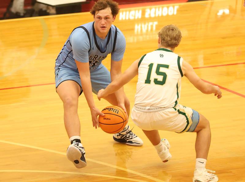 Bureau Valley's Blake Foster dribbles around St. Bede's Geno Dinges during the Colmone Classic on Thursday, Dec. 11, 2025 at Hall High School.