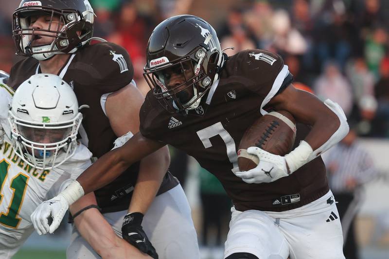 Joliet Catholic’s HJ Grigsby rushes against Providence in the Class 5A semifinal on Saturday, Nov. 18, 2023, in Joliet.