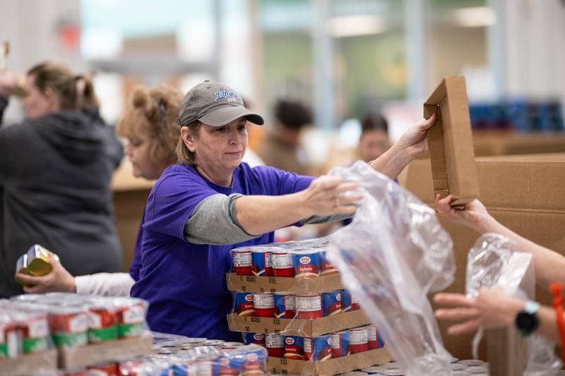More than 100 volunteers from Northwestern Medicine came out to the Northern Illinois Food Bank's Geneva location to pack up donations on Saturday, Feb. 24, 2024. Northwestern Medicine donated $200,000 across area food banks including three NIL food bank locations — Geneva, Joliet and Lake Forest — and the Greater Chicago Food Depository.