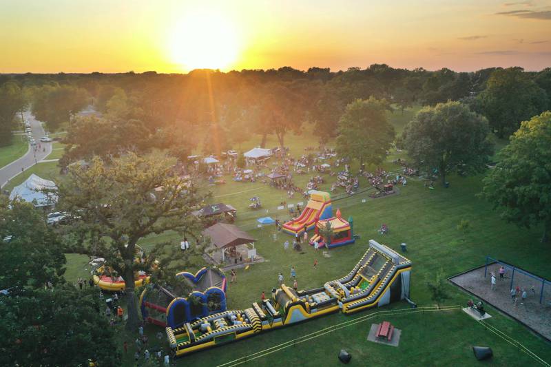 The sun sets over the Taste of the Illinois Valley festival on Saturday, Aug. 3, 2024 at Centennial Park in Peru.