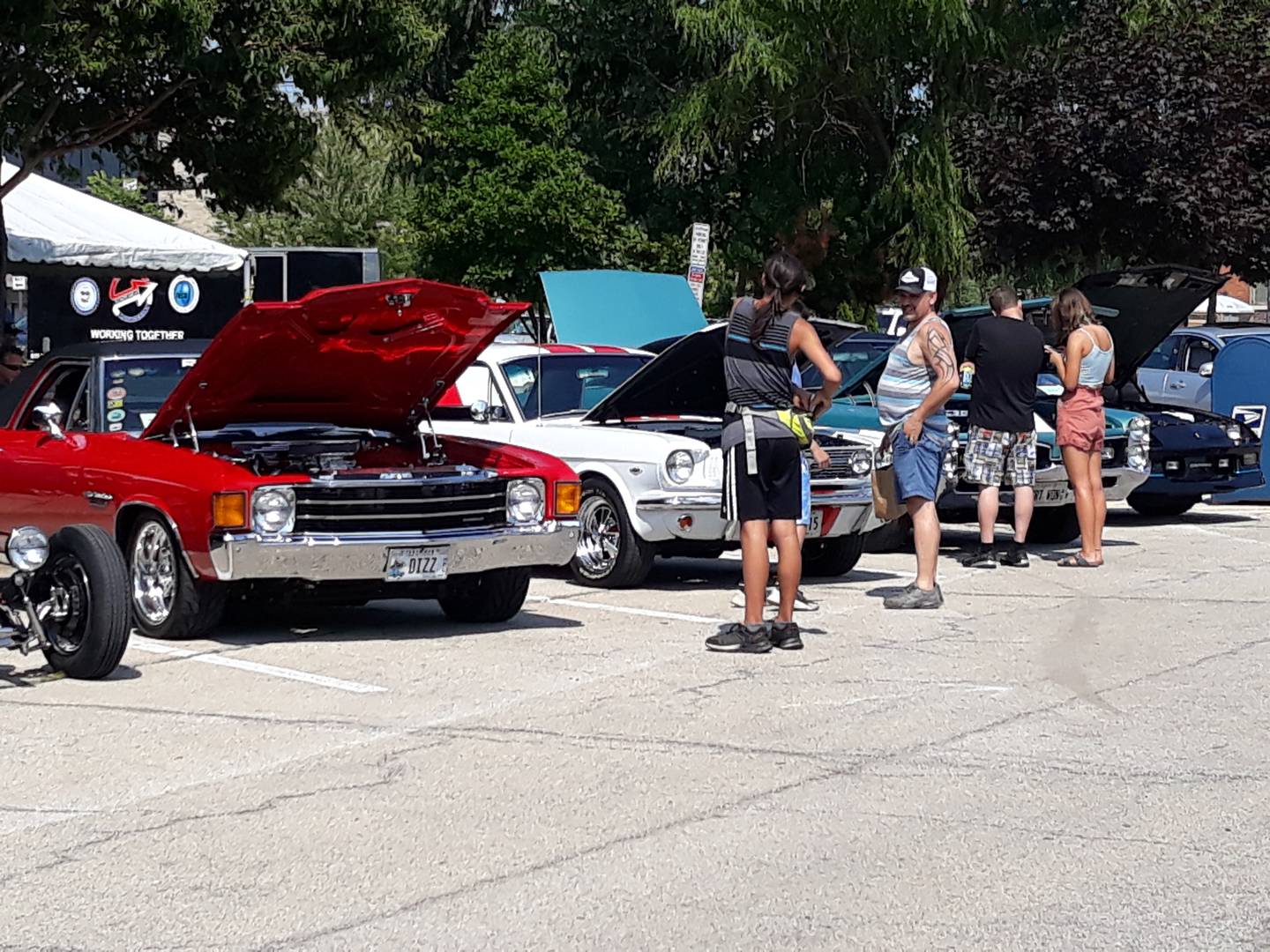 People check out the classic cars Saturday, July 31, 2021, at the 37th annual La Salle County Cruisers car show in downtown Ottawa.