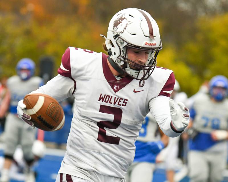 Prairie Ridge's Logan Thennes (2) runs the ball in for a touchdown on Saturday Nov. 8, 2025, during the second round of the 5A playoff game held at St. Francis's High School.