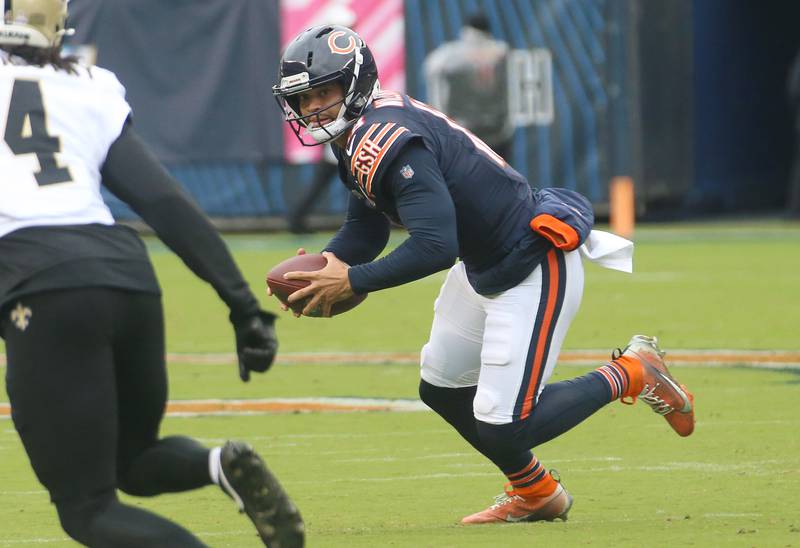 Chicago Bears quarterback Caleb Williams looks down field to throw as New Orleans Saints corner back Kool-Aid McKrinstry eyes the play on Sunday, Oct. 19, 2025 at Soldier Field in Chicago.