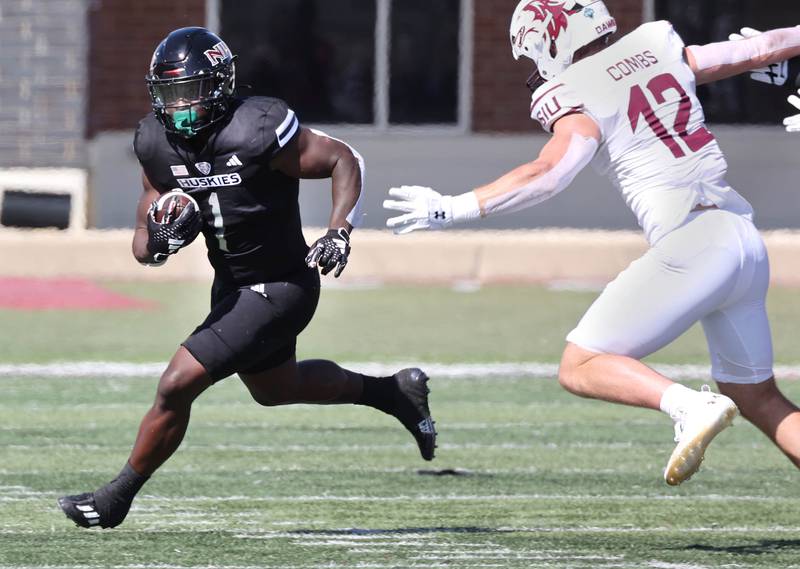 Northern Illinois' Antario Brown gets outside of Southern Illinois' Branson Combs during their game Saturday, Sept. 9, 2023, in Huskie Stadium at NIU in DeKalb.