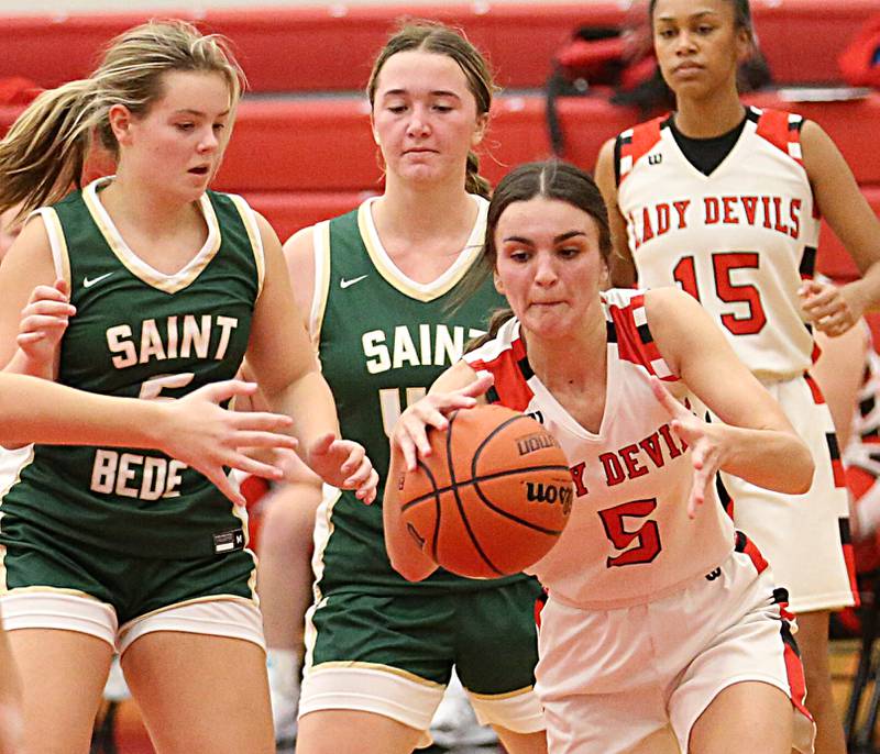 Hall's Promise Giacometti (5) grabs a rebound over St. Bede's Sadie Koehler (5) and teammate Ella Hermes (42) on Monday, Nov. 28, 2022 at Hall High School in Spring Valley.