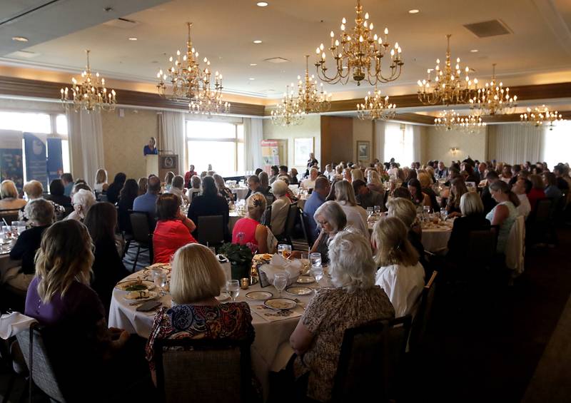 People listen to award recipient Nancy Binger speak during the Northwest Herald's Women of Distinction award luncheon Wednesday June 7, 2023, at Boulder Ridge Country Club, in Lake in the Hills. The luncheon recognized 10 women in the community as Women of Distinction.