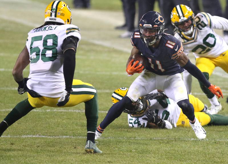 Chicago Bears wide receiver Darnell Mooney (11) looks to put a move on Green Bay Packers inside linebacker Christian Kirksey (58) after a catch during their game Sunday at Soldier Field in Chicago.