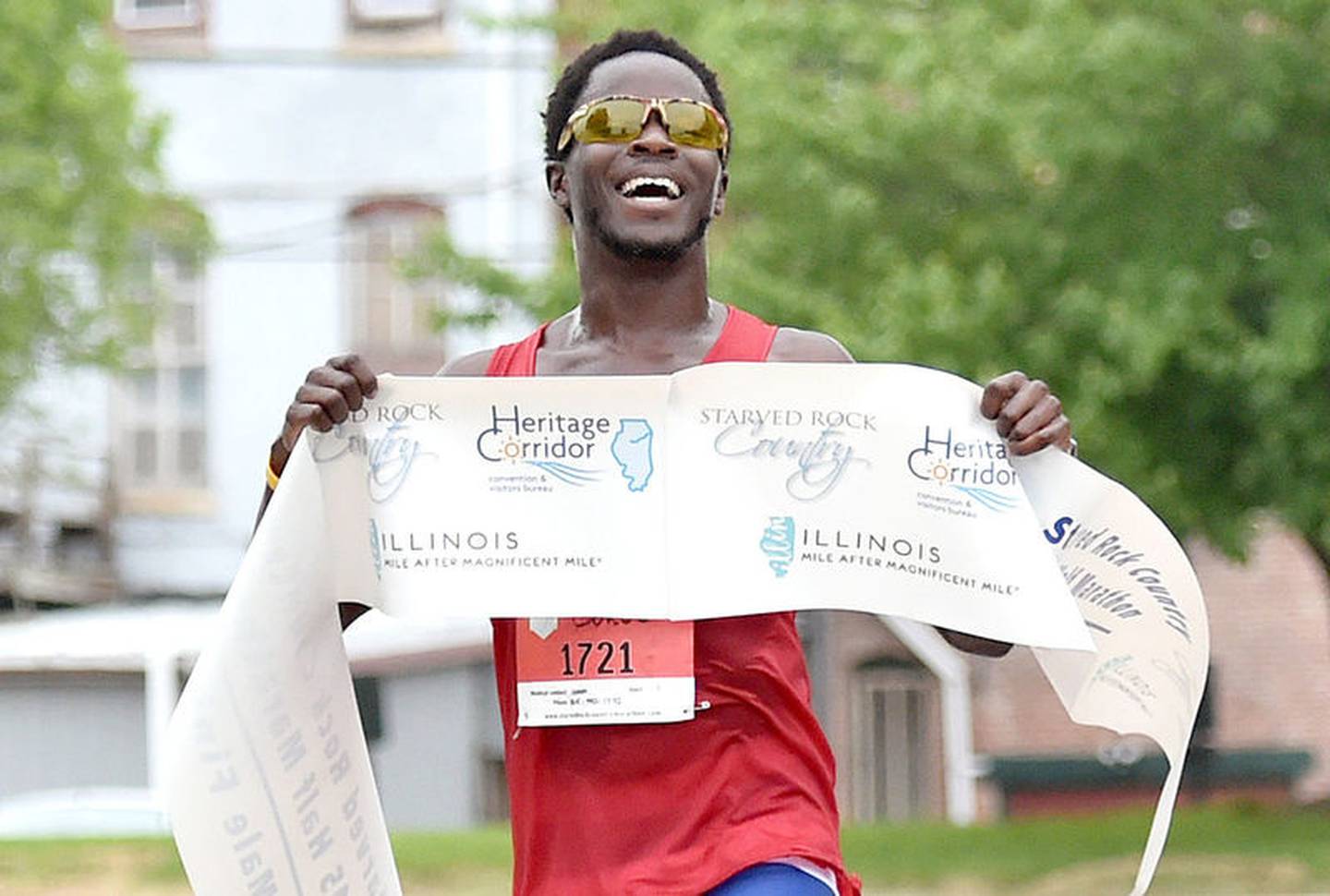 Starved Rock Country Half Marathon winner Coree Woltering, of Leadville, Colo., crosses the finish Saturday morning.