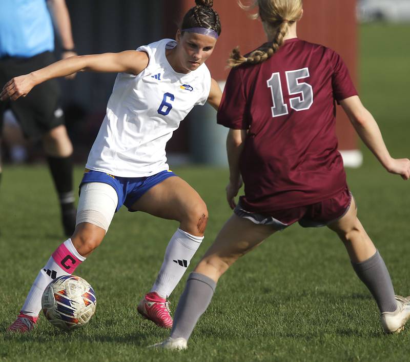 Johnsburg’s Liz Smith controls the ball in front of Marengo's Sophie Hanson during a Kishwaukee River Conference soccer match on Wednesday, April 15, 2026, at Marengo High School.