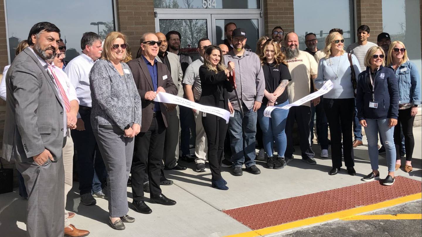 St. Charles Chamber of Commerce hosts a ribbon cutting Tuesday April 18, 2023, outside the new Consume Cannabis at 584 Randall Road in St. Charles.