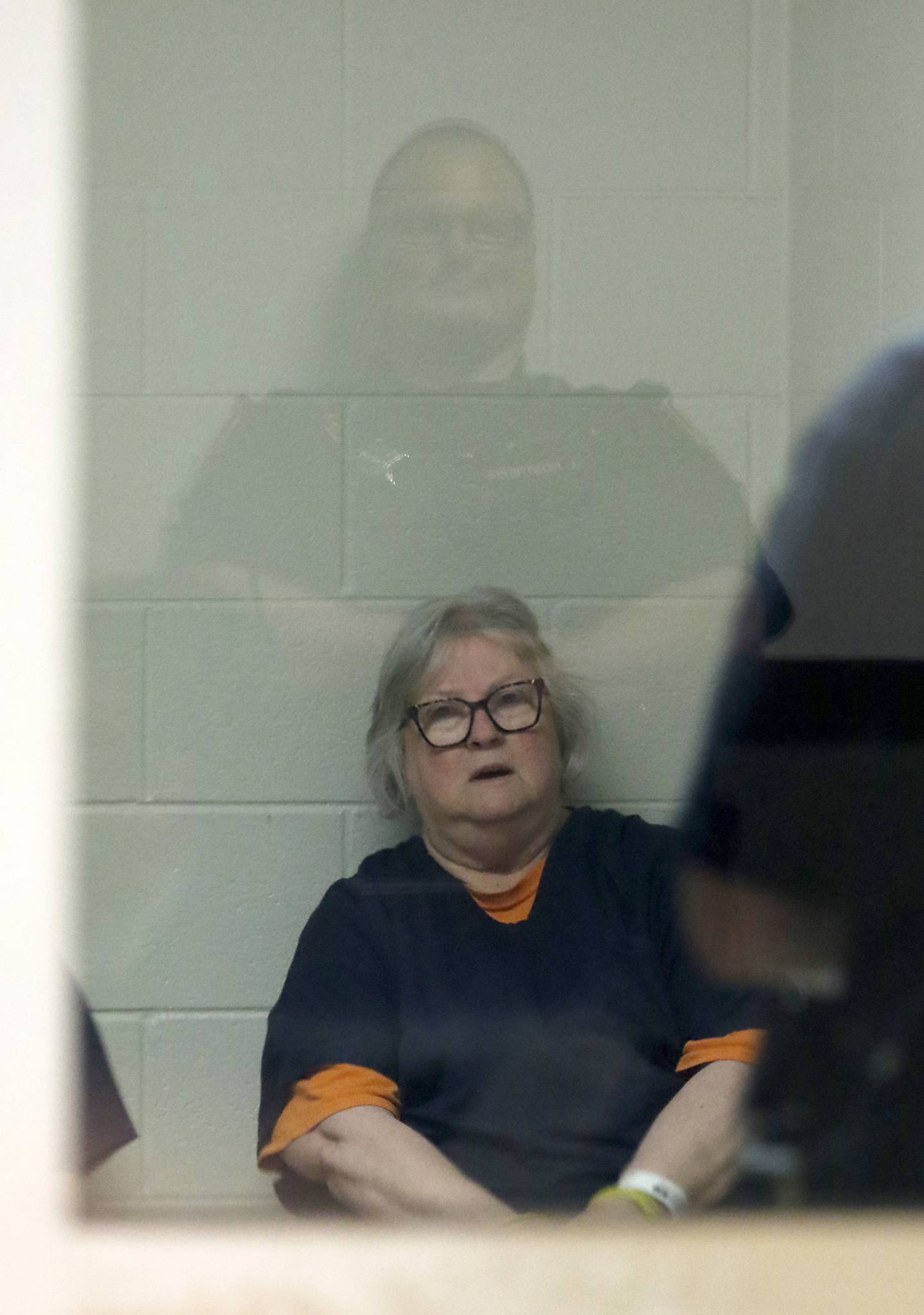 Roxanna L. Collins of McHenry talks with her lawyer Patrick Cafferty as she waits to be taken into court in Kenosha County on Monday, June 2, 2025, before what was to be her first appearance. The hearing was delayed. She was charged with first-degree intentional homicide in the 2003 death of her husband, David Vanderzee.