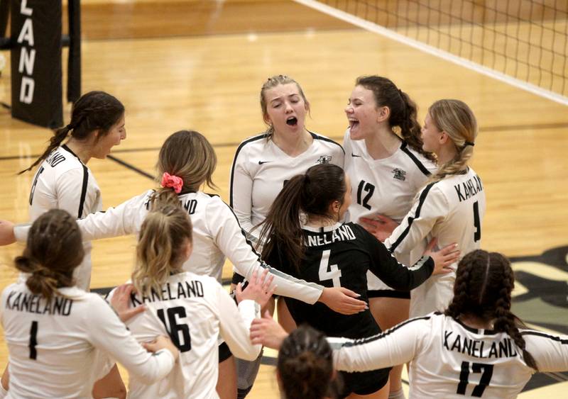 Kaneland’s Sophie Knazur (12) and the Kaneland team celebrate their home game win over Morris on Thursday, Oct. 13, 2022.