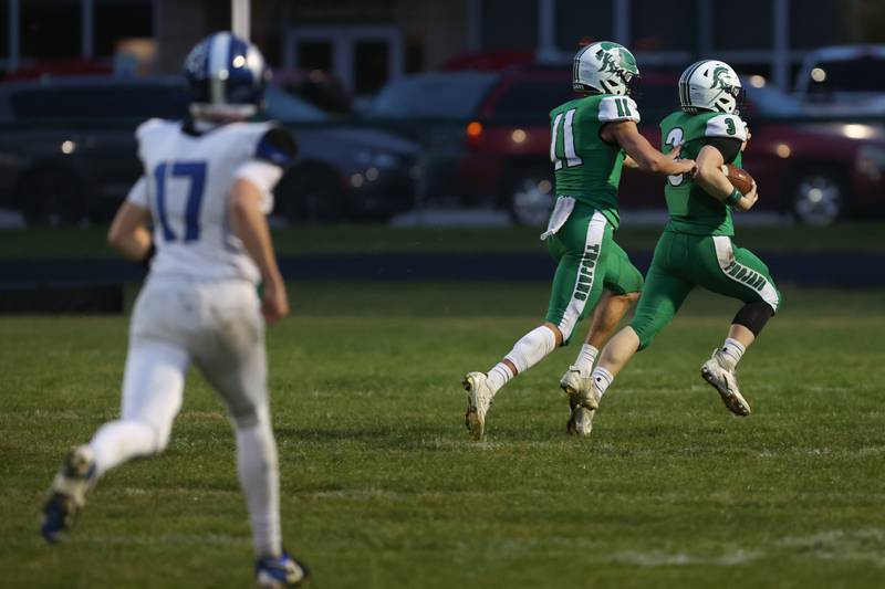 Dwight's Collin Bachand returns a pick six in the first half as teammate Joey Starks accompanies him to the end zone during Dwight's 43-14 victory over Clifton Central in second round playoffs on Saturday, Nov. 8, 2025.