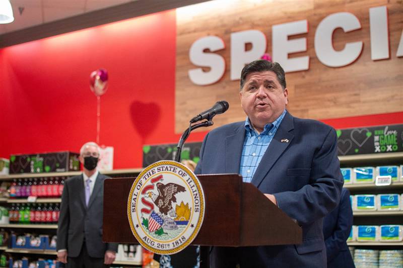 Gov. JB Pritzker speaks at Schnucks grocery store in Springfield Tuesday at a news conference touting his plan to suspend the 1 percent tax on groceries for the upcoming fiscal year. He told reporters to "stay tuned" for an upcoming announcement on the state's mask mandate