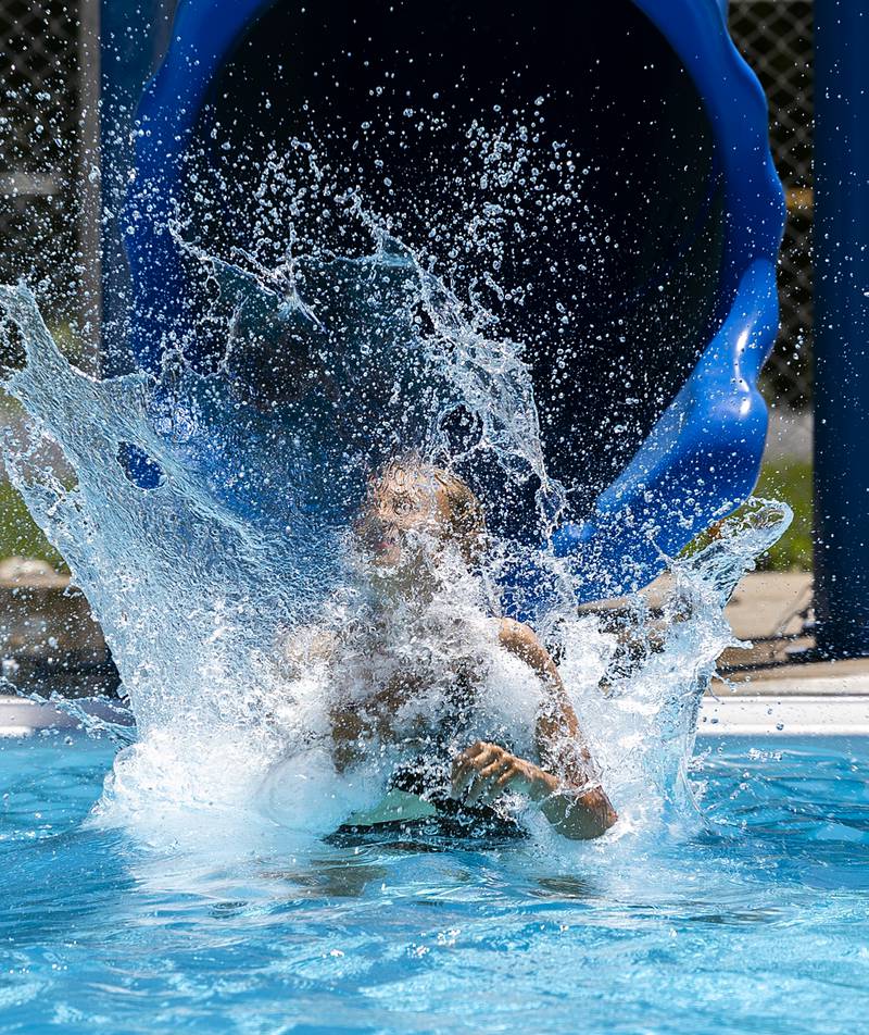 Tenlei Patterson, 12, of Polo splashes down after going down the slide Wednesday, June 5, 2024 at the Polo pool.