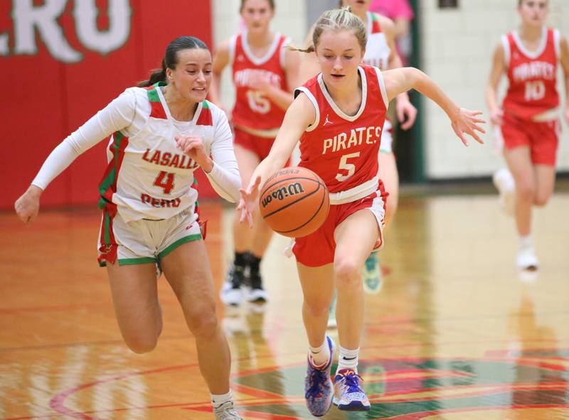 Ottawa's Grace Carroll sprints down the floor on a break away as L-P's Brooklyn Ficek chases after her on Friday, Jan. 27, 2023 at L-P High School.