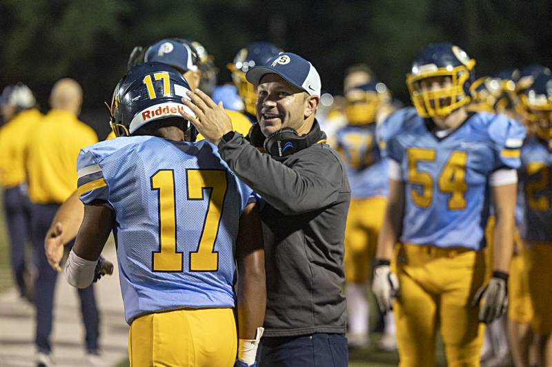 Sterling coach Jon Schlemmer celebrates Sterling’s Kaedon Phillips TD catch against Galesburg Thursday, Sept. 14, 2023 at Sterling High School.