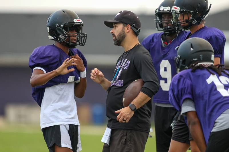 Amari Bryant receives instructions at Plano High School football practice.  August 9, 2023.