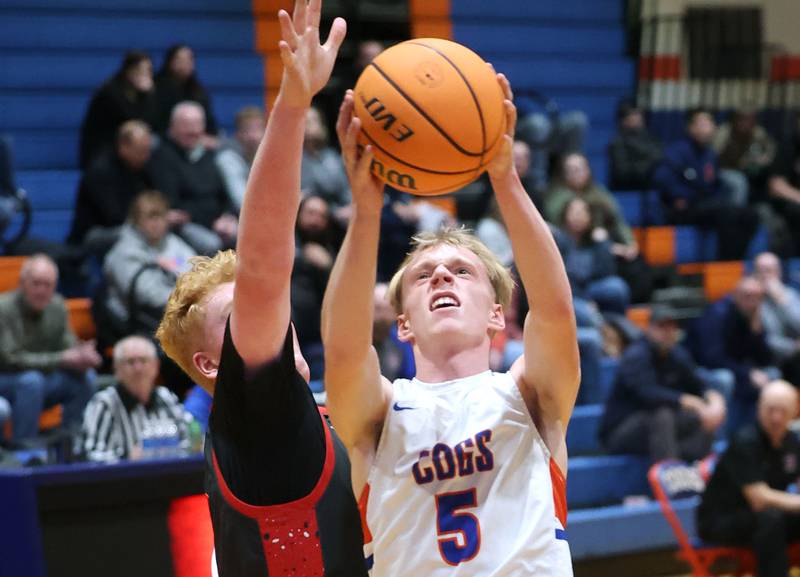 Genoa-Kingston's Blake Ides goes to the basket against Indian Creek's Isaac Willis during their game Friday, Jan. 2, 2026, at Genoa Kingston High School.