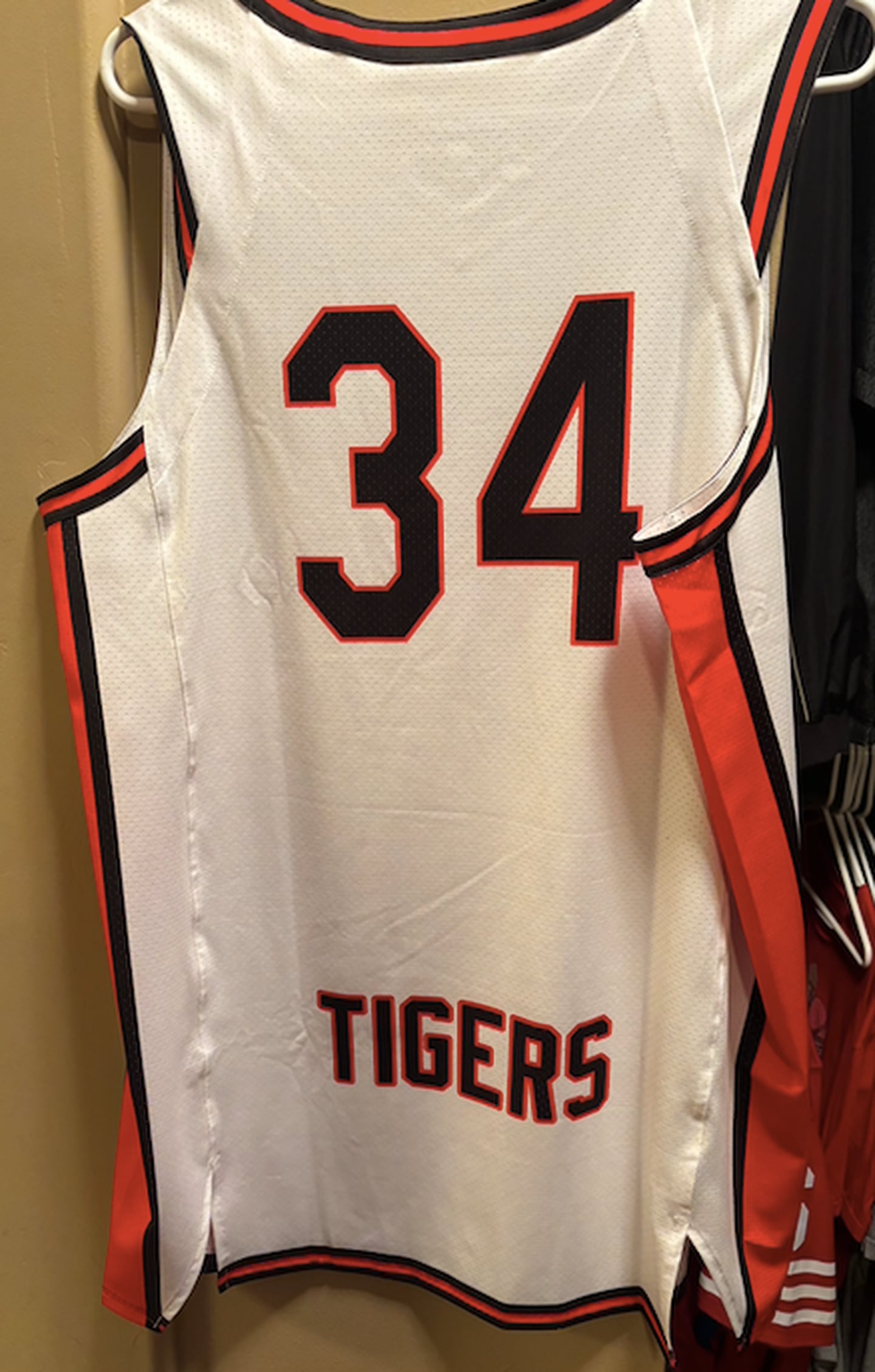 A replica of Alan Jerousek's 1986 Crystal Lake Central Tigers basketball jersey.