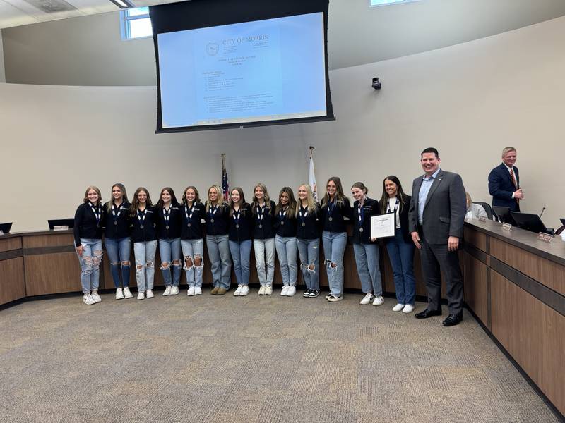 The Morris Community High School dance team with Morris Mayor Chris Brown.